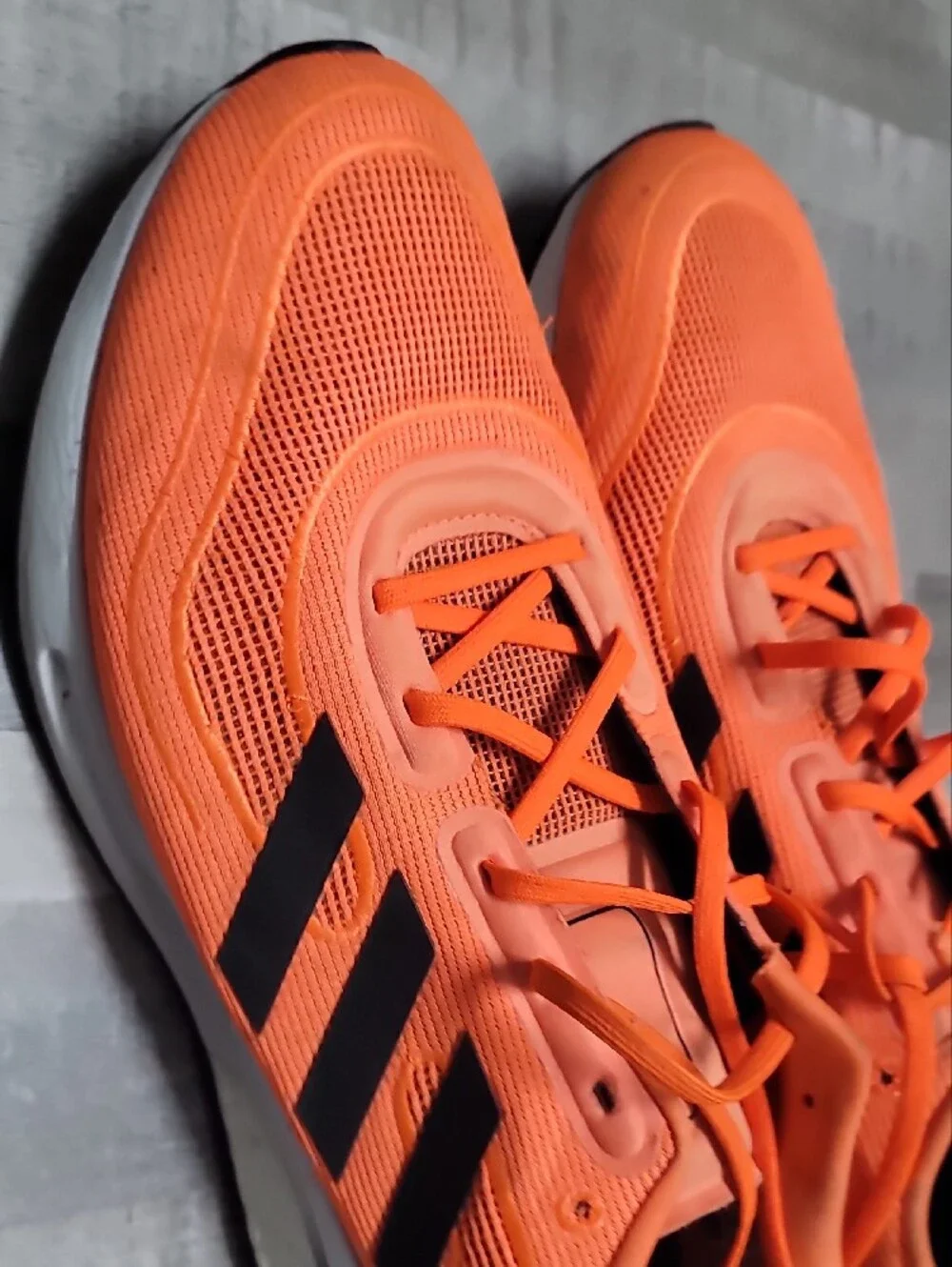 adidas Men’s Bright Orange Athletic Sneakers with Black Stripes